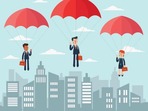 Business people with parachute over city